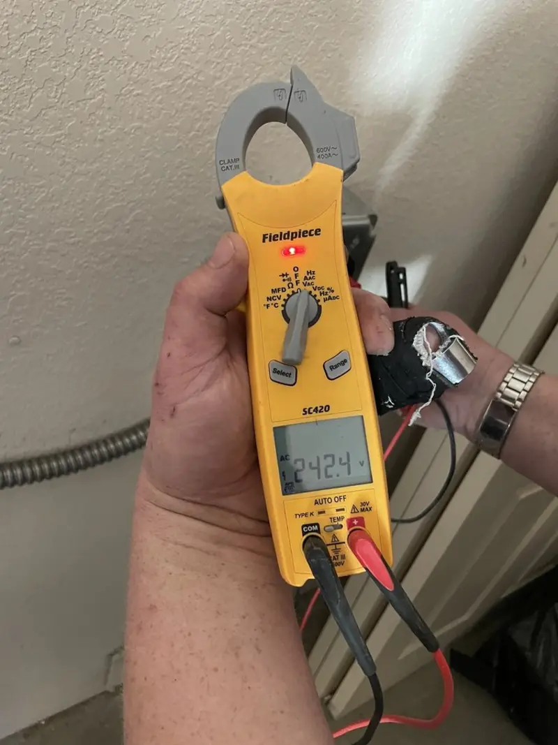 Voltage testing with clamp meter during Electrical Installation Services in North Springfield